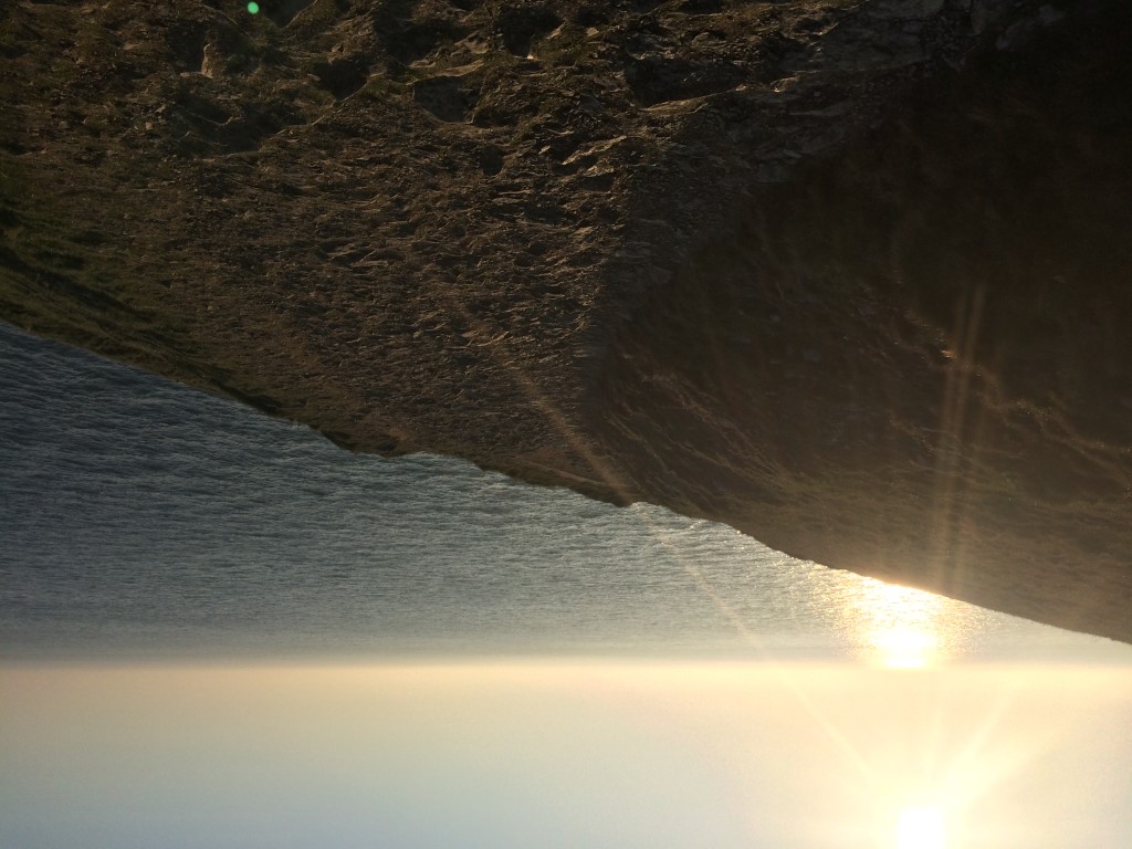 Photograph of the sunrise over the coast path